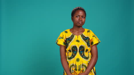 Young-natural-woman-looking-both-left-and-right-sides-in-studio