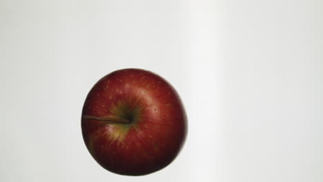 Apple-rolls-on-a-glass-plate-in-slow-motion-100-fps