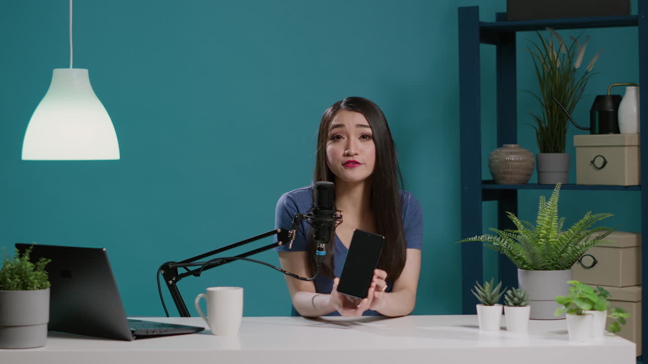 POV of influencer broadcasting video on smartphone review