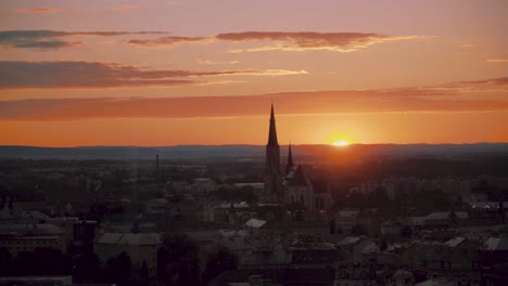 Colorful-Sunset-Skyline-Above-European-City,-Focus-In-church