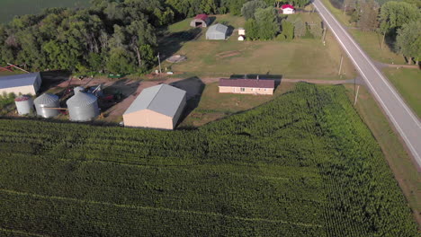 forward moving aerial drone shot of farm house