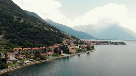 Panoramic-drone-footage-of-Domaso,-a-small-municipality-in-the-province-of-Como-in-the-Italian-region-of-Lombardy,-Italy-along-the-coast-of-Lake-Como