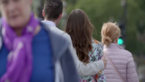 Couple-Walking-along-Westminster-Bridge