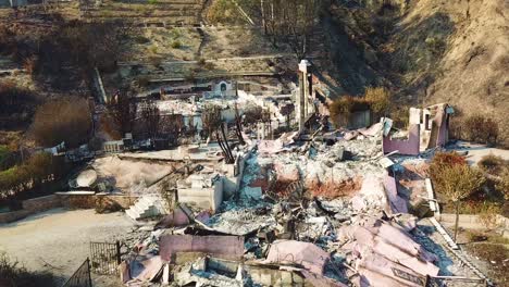 Aerial-over-a-hillside-home-destroyed-by-fire-in-Ventura-California-following-the-Thomas-wildfire-in-2017-2