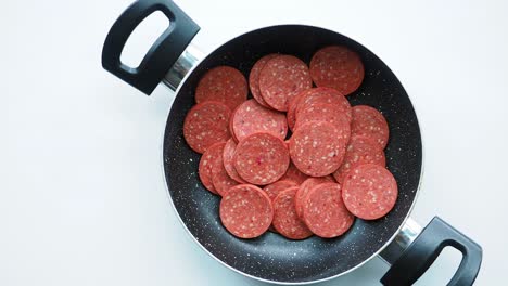 sliced sausage in a pan