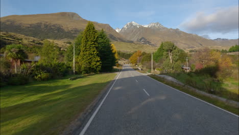 journey on scenic road from queenstown to otago on sunny day in autumn in new zealand