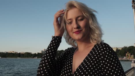 girl-on-the-shore-smiling-at-the-camera