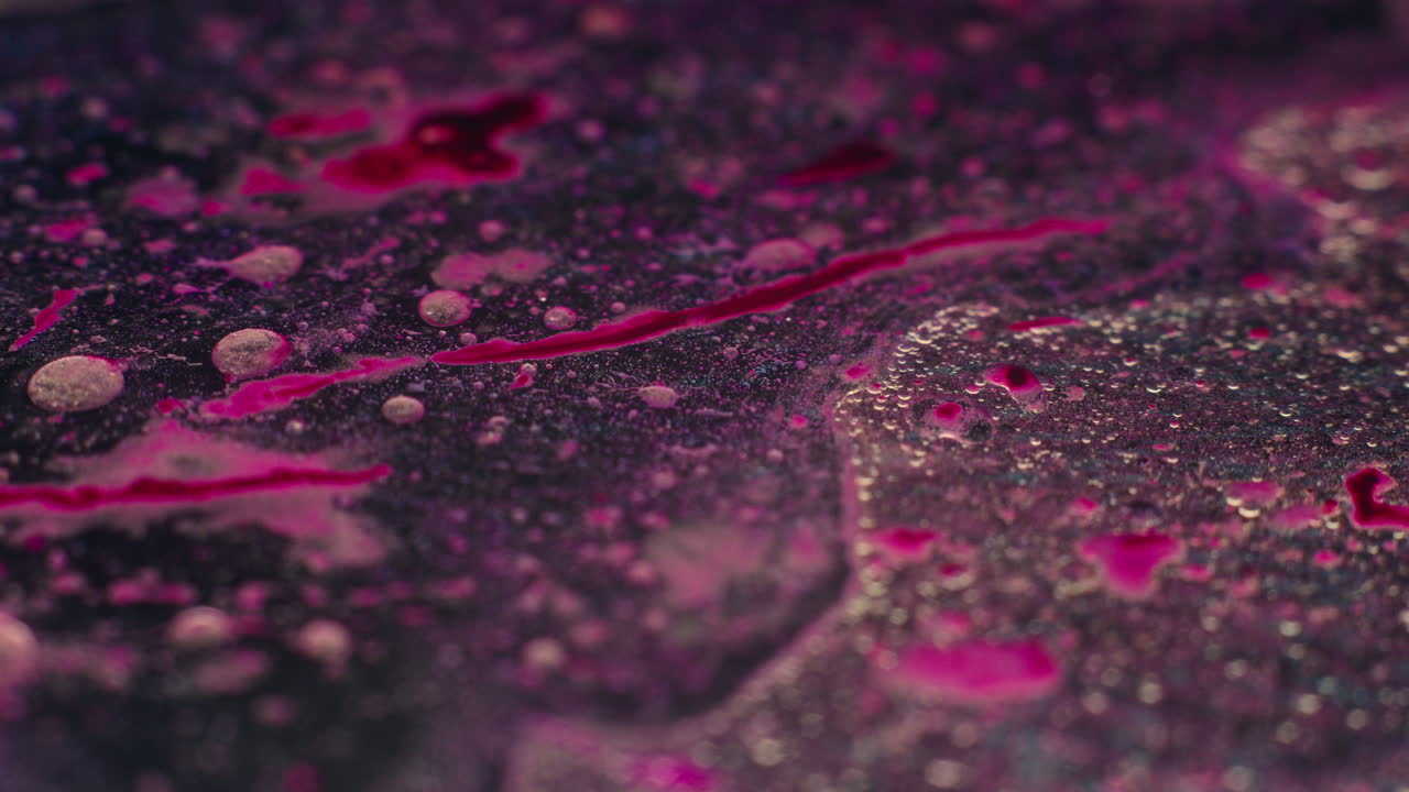 Colourful, organic, liquids macro shots buzzing and flowing