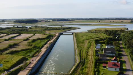 aerial pass over the canals and dams of waterdunes - a nature area and recreational park in the province of zeeland, the netherlands