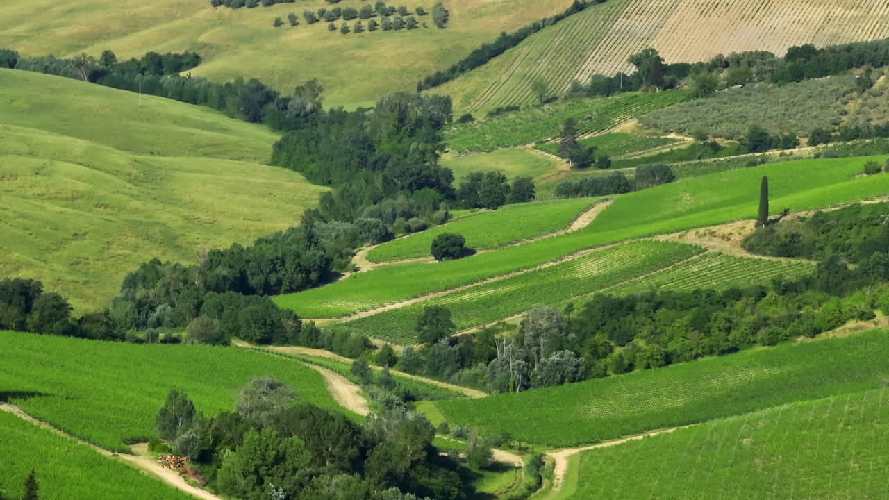 Telephoto drone shot of rural nature on the countryside of Tuscany, Italy