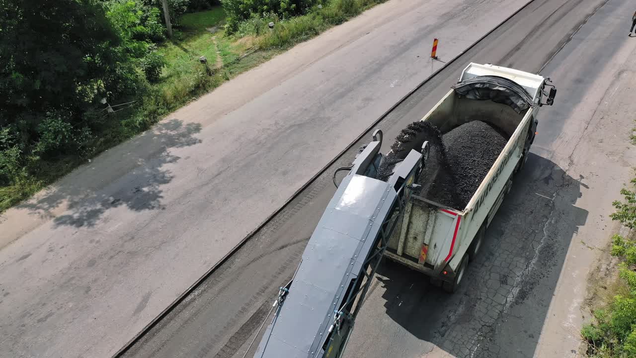 Machinery work construction road. Industrial dumper trucks working on highway construction site