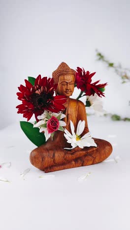 buddha statue with flowers