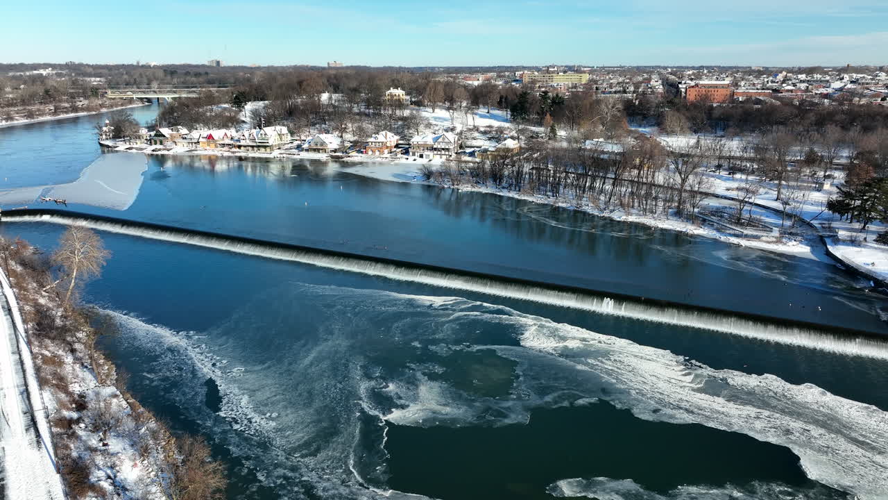 Frozen river waterfall in American city