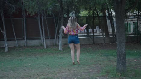 woman dancing in park