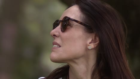 beautiful confident woman reflects on her surroundings, slow motion