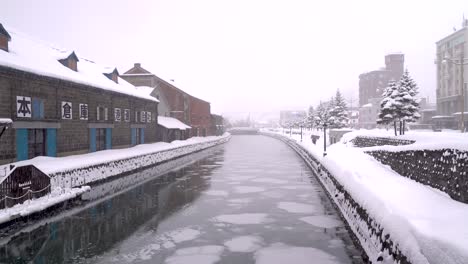 snowy weather at otaru canal, famous tourist spot in hokkaido with few people