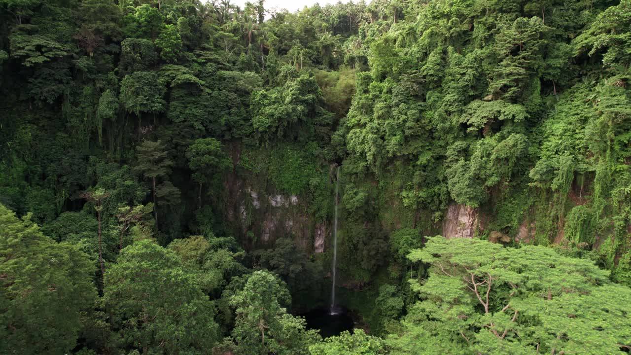 Aerial View of Katibawasan Falls in Tropical Rainforest and Landscape of Camiguin Island, Philippines