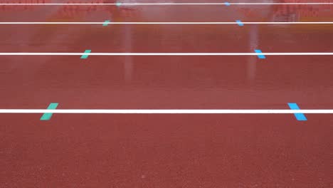 rainy day, athletics track in the stadium. the lines are horizontal.