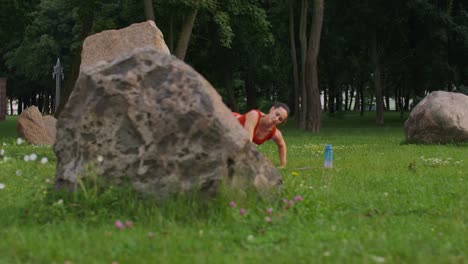 woman practicing yoga in a park