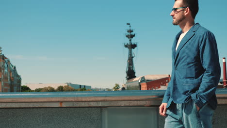 man in a blue striped blazer, city view