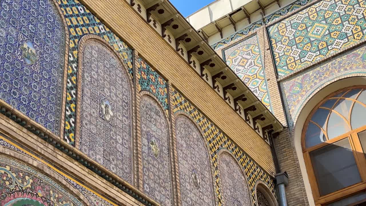 Triple gate architecture in Islamic design colorful tiles of mosaic pattern royal mansion Golestan palace historic landmark decorative exterior beauty capital Tehran Persia heritage travel destination