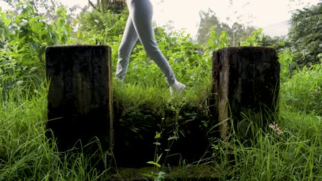 two runners easily cross a small bridge along their route