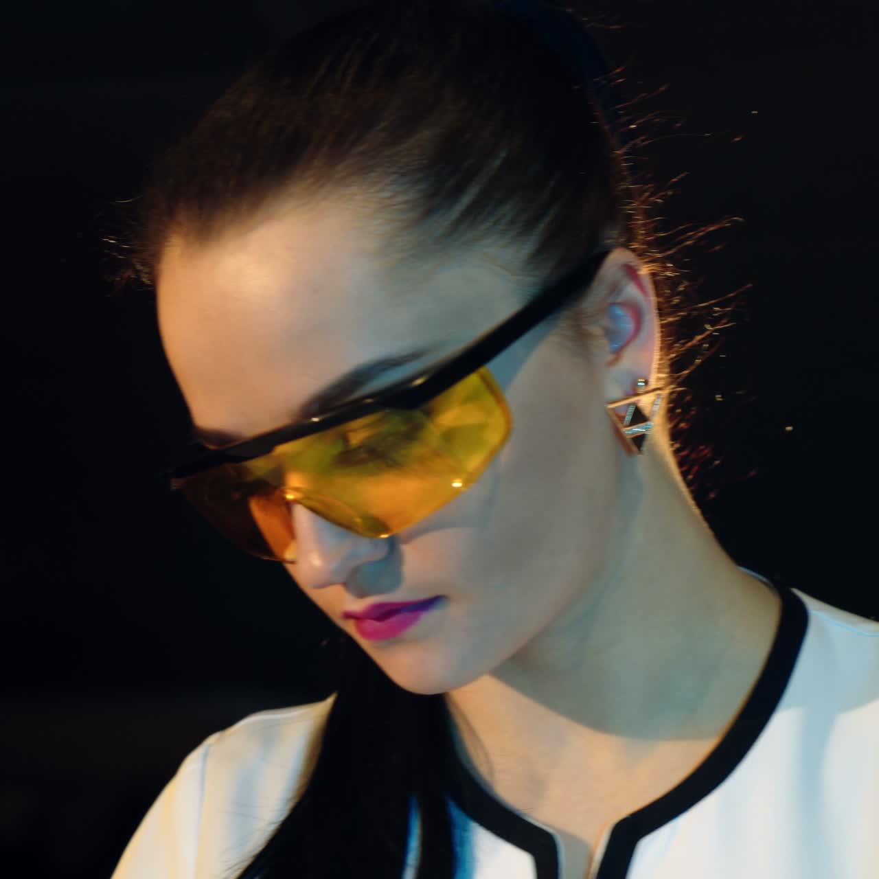 Woman scientist mixing together two liquid substances. Laboratory examination.