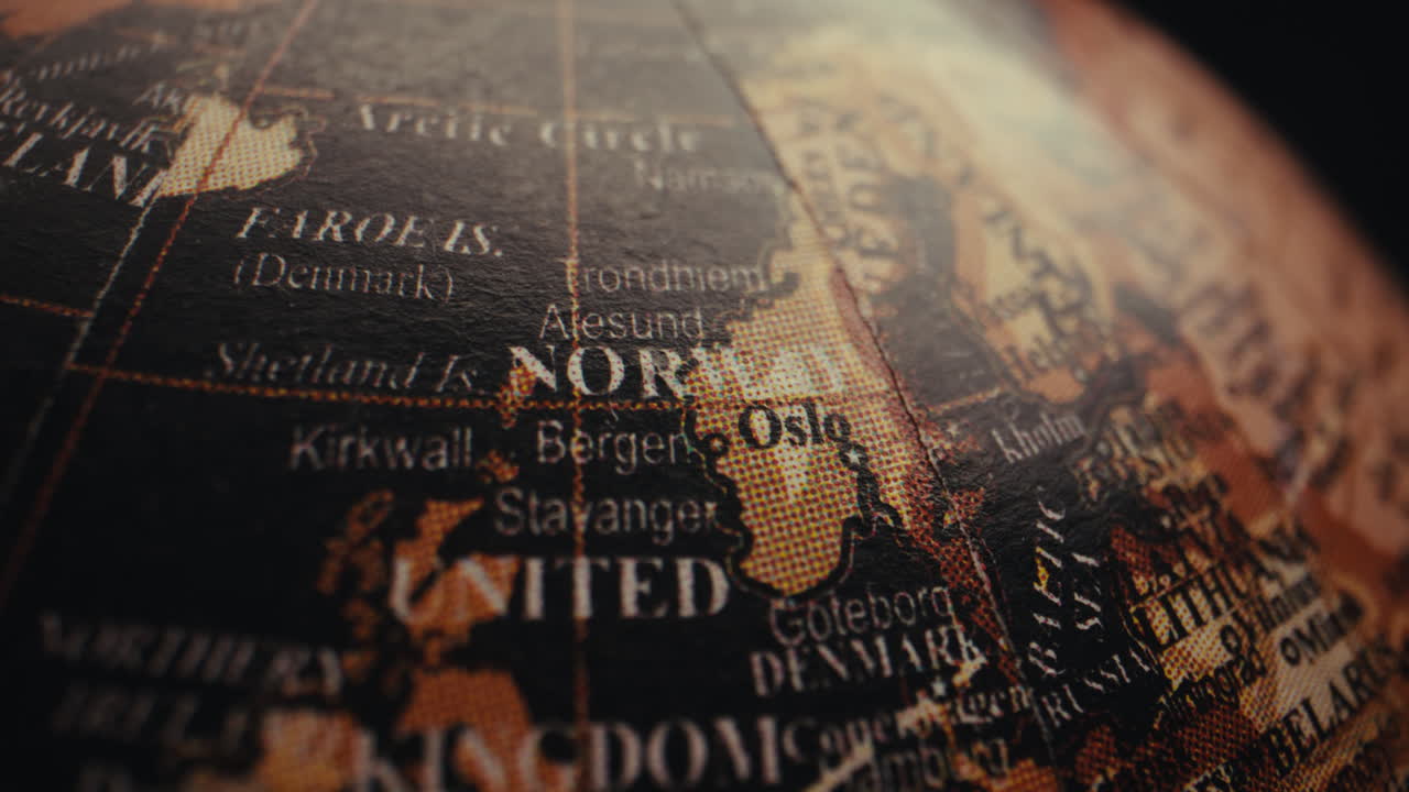 Close-up of a vintage globe, focusing on the region of Norway and surrounding areas.