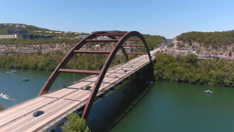 moving backwards drone shot of the pennybacker bridge in austin, texas