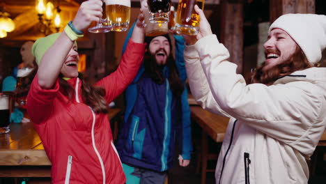 friends enjoying beer at a mountain lodge
