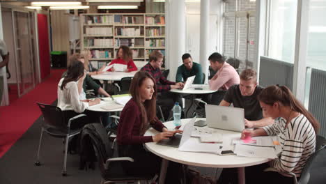 busy university library with students and tutor