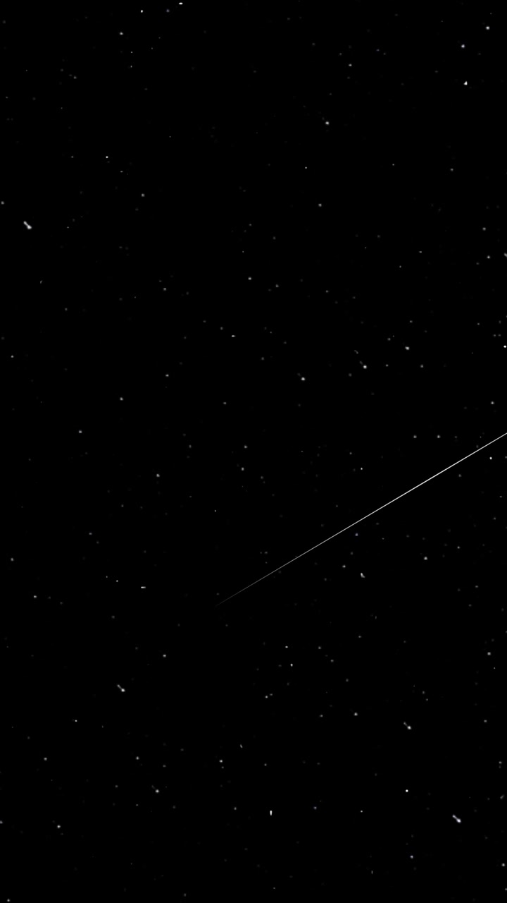Shooting Stars Streaking Across a Dark Night Sky