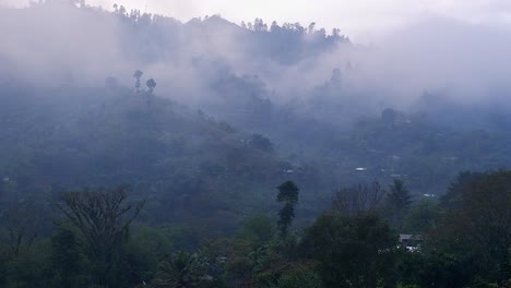 Low-cloud-drifts-through-jungle-village-on-mountain-side-in-Guatemala