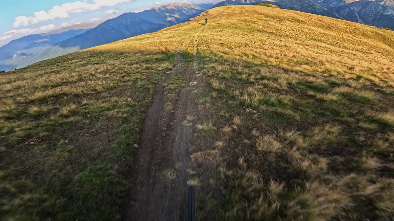 First Person View of Mountain Biking Uphill on a Scenic Ridge