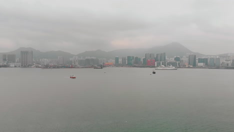 industrial gray cityscape with a foggy mountainous horizon