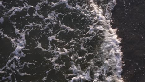 Overhead-waves-as-seen-from-Folly-Beach-pier,-South-Carolina