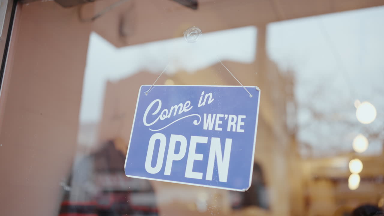Open Sign on a Store Front Window