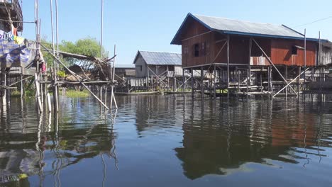 stilted houses in village on famous inle lake