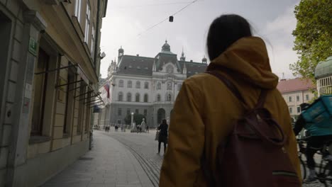 Young-woman-tourist-exploring-Ljubljana-city-in-Slovenia-during-spring-holidays