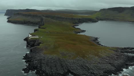 aerial footage of neist point on the isle of skye, scotland, uk. standing at 62ft, neist point is one of the most famous lighthouses in scotland and can be found on the most westerly tip of skye.