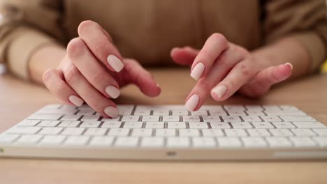 hands typing on a keyboard