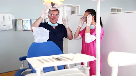 Happy-dentist-chatting-with-nurse