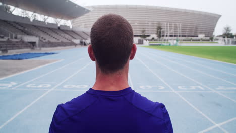 athlete standing on running track