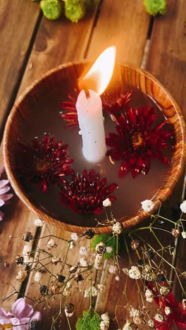 autumnal candle arrangement with flowers