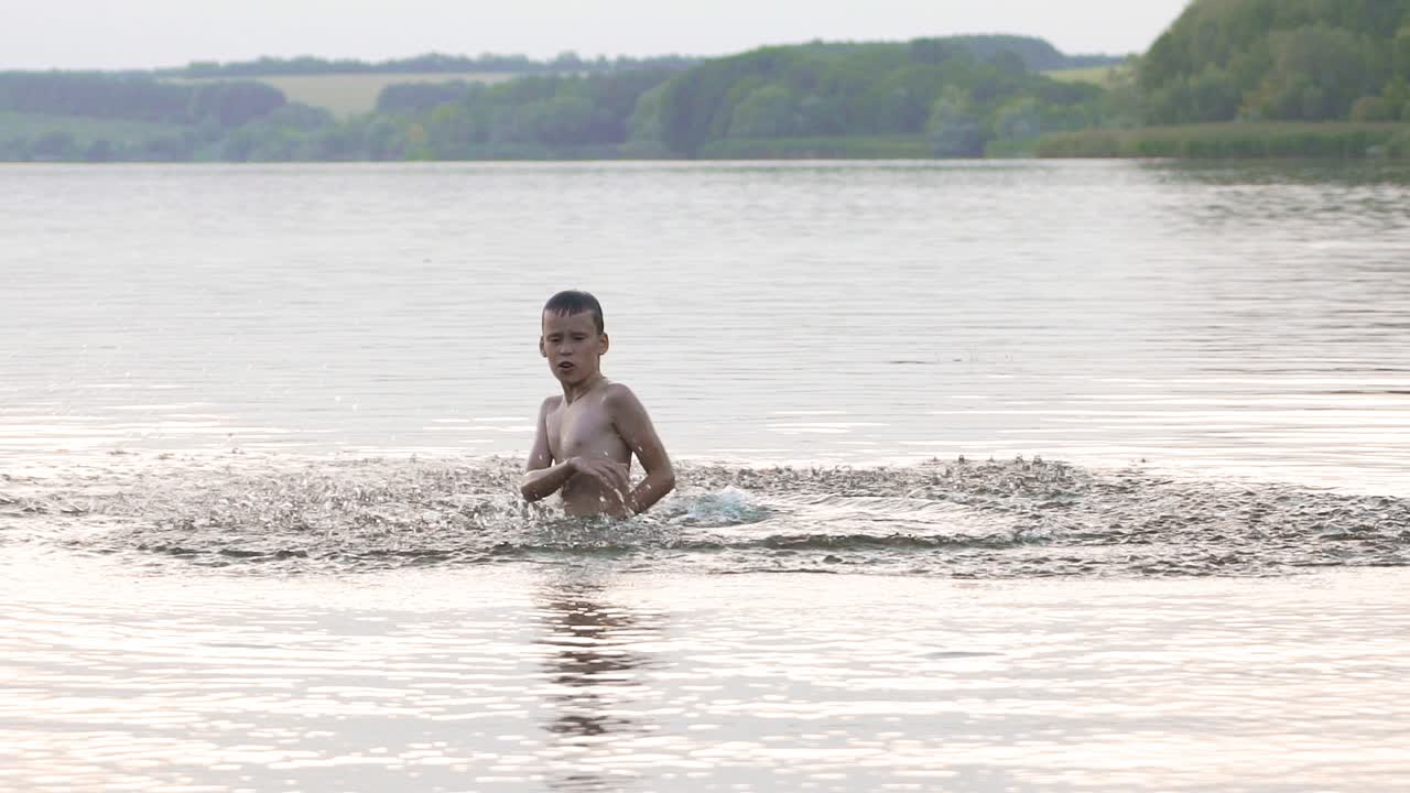 Jumping in the water. Boy are having fun and splashing in the water. Summer holiday concept