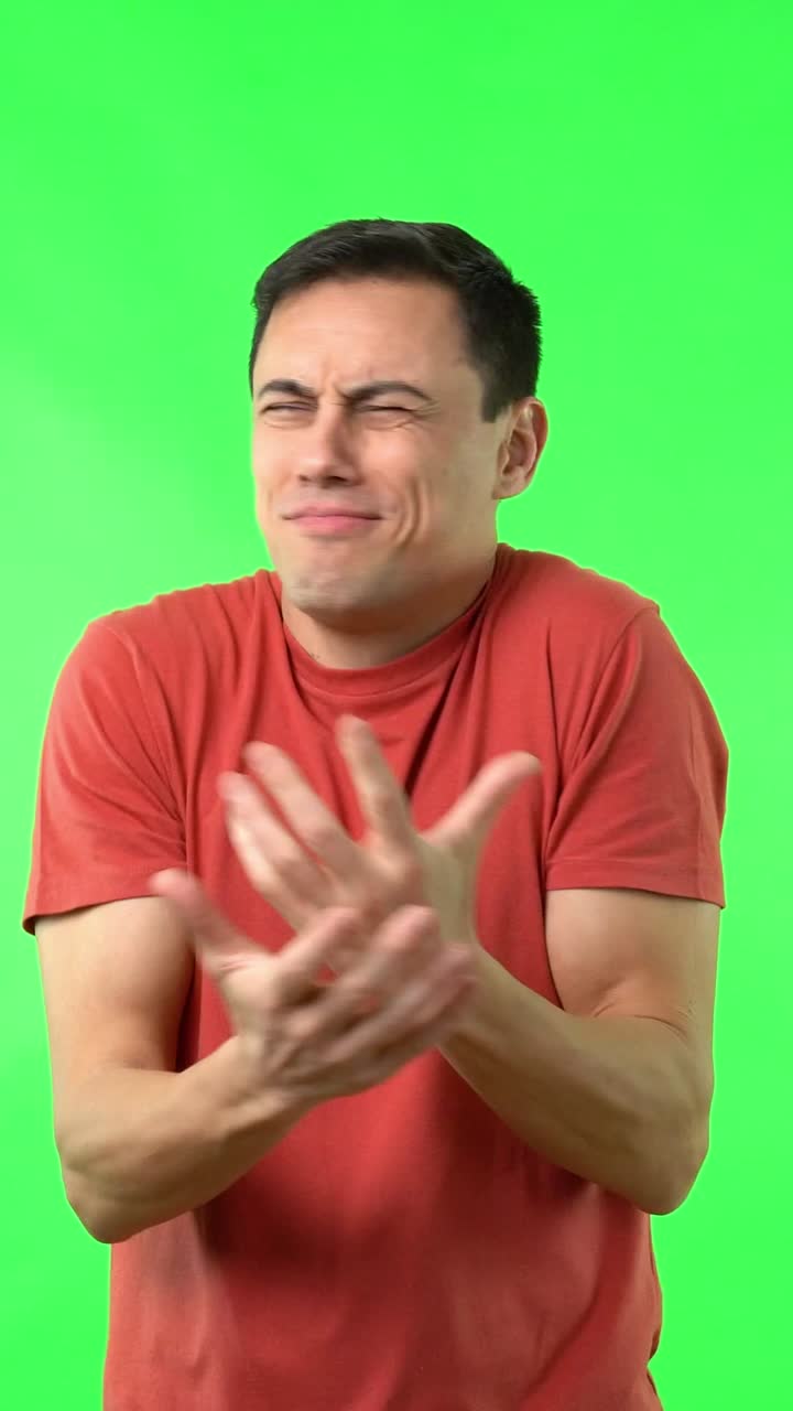 Man giving thumbs up on green screen