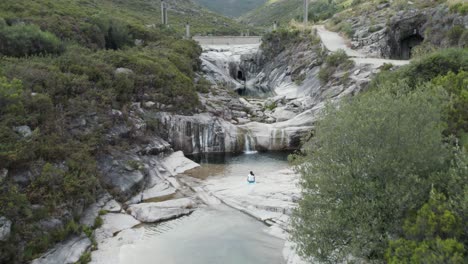 aerial pullback revealing breathtaking 7 lagoons trail, natural pure water pools, gerês