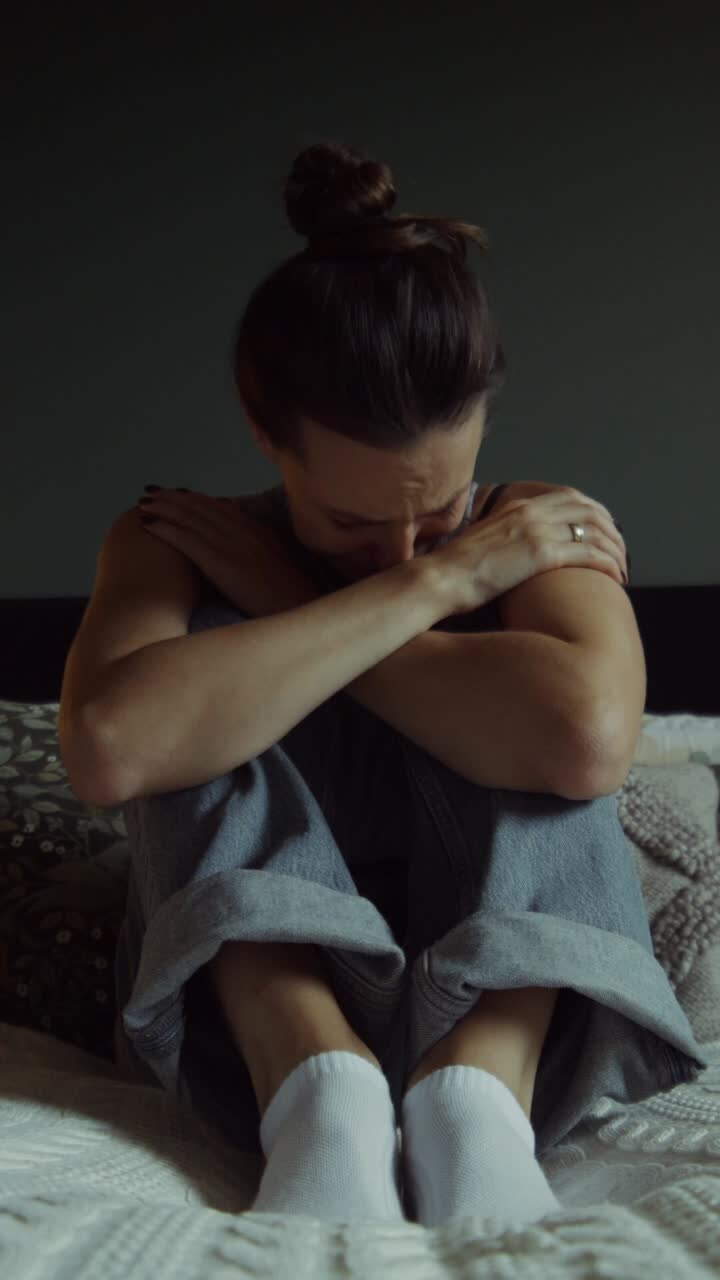 Woman Crying on Bed