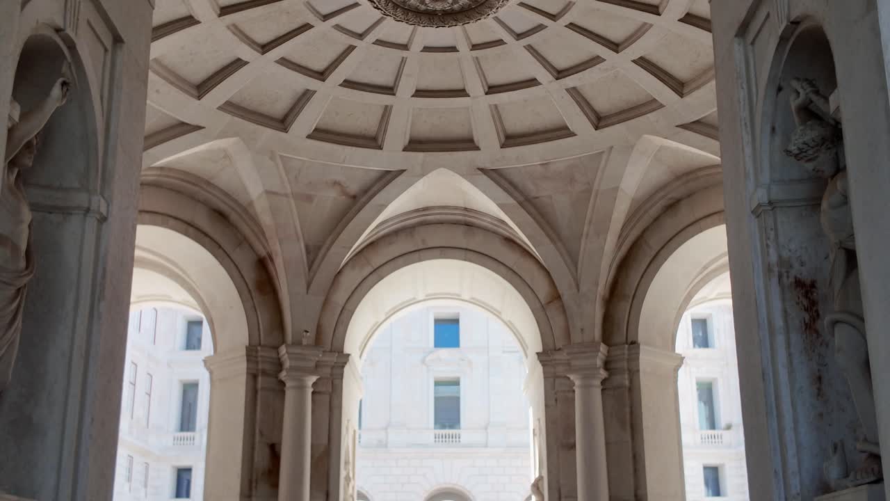 Lisbon Palace of Ajuda interior dome with arches statues and classical symmetry