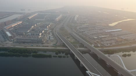 aerial view of urban development project with highway and construction sites